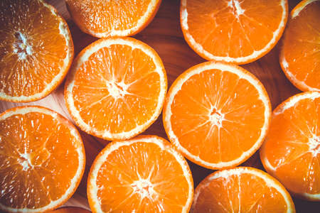 Bunch of fresh organic sliced oranges on a trayの写真素材