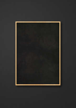Traditional blackboard isolated on a black background. Blank vertical mockup templateの写真素材