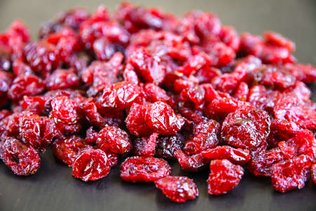 Dried bunch of organic cranberries on a kitchen table.の写真素材