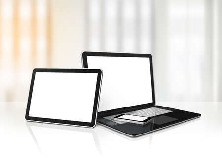 Laptop, mobile phone and digital tablet pc on office desk interior background. 3D Illustrationの写真素材