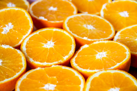 Bunch of fresh organic sliced oranges on a trayの写真素材
