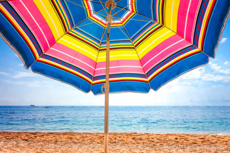 Colorful umbrella close-up view on a tropical beachの写真素材
