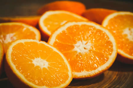 Bunch of fresh organic sliced oranges on a trayの写真素材