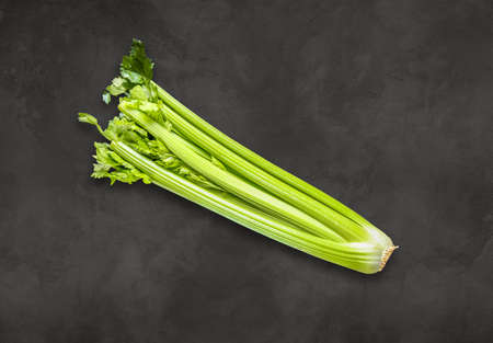 Celery branch bunch on a concrete background. Top viewの写真素材