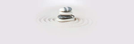 Black and white stones in the sand. Zen japanese garden background scene. Horizontal banner