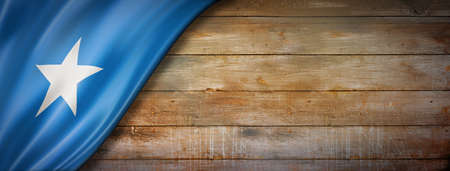 Somalia flag on vintage wood wall. Horizontal panoramic banner.の写真素材