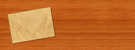 Brown paper enveloppe mockup template isolated on horizontal wooden bannerの写真素材