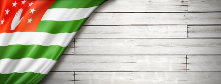 Abkhazia flag on old white wall. Horizontal panoramic banner.の写真素材