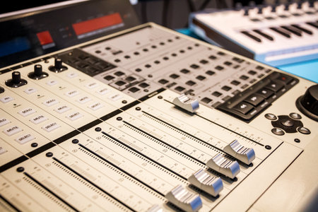 Paris - France -December 1, 2020 : Mackie Control Universal Pro. audio mix table close up view.のeditorial素材