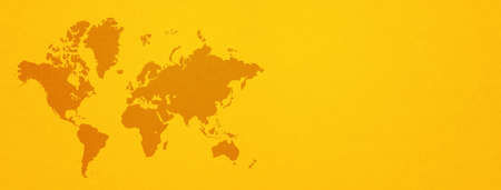 World map isolated on yellow wall background. Horizontal bannerの写真素材