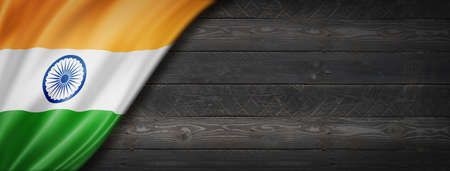 India flag on black wood wall. Horizontal panoramic banner.の写真素材
