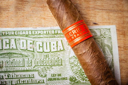 Paris - France - March 23, 2021 : Partagas cuban cigar on vintage wooden box with Cuban official tax labelのeditorial素材