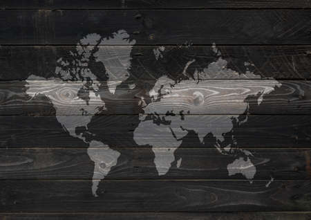 World map isolated on black wooden wall background