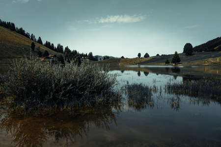 Lake of the Confins and Mountain landscape at sunrise. La Clusaz, Haute-savoie, France