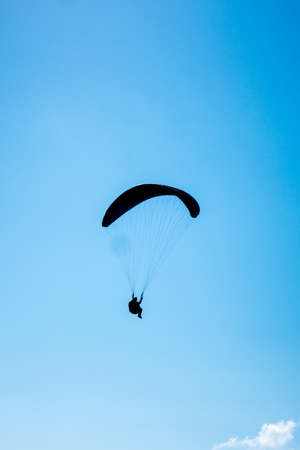 paragliding flight in the mountains. Le Grand-Bornand, Haute-Savoie, France