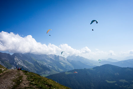 paragliding flight in the mountains. Le Grand-Bornand, Haute-Savoie, France
