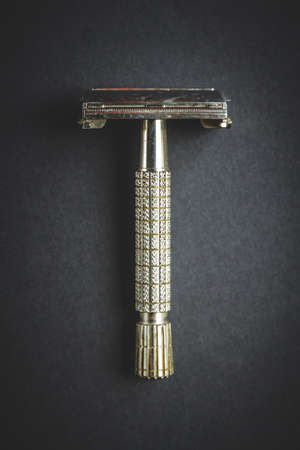 Old classic vintage shaver razor on a black backgroundの写真素材