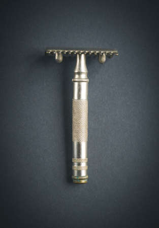 Old classic vintage shaver razor on a black backgroundの写真素材