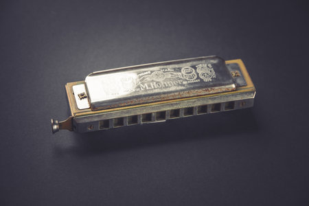 Paris - France - March 1, 2022 : Vintage M. Hohner harmonica isolated on a black backgroundのeditorial素材