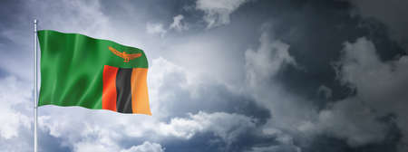 Zambia flag on a cloudy sky, three dimensional renderの写真素材