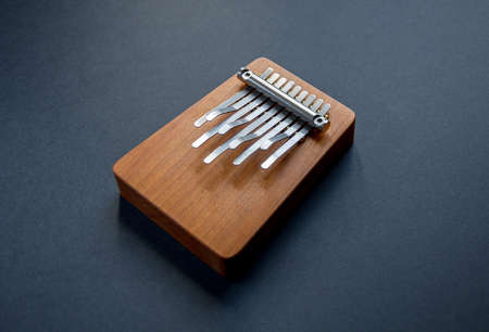 Traditional wooden kalimba isolated on black backgroundの写真素材