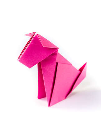 Pink paper dog origami isolated on a blank white background.の写真素材
