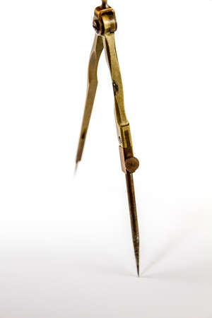 Old vintage pair of compasses isolated on a white background