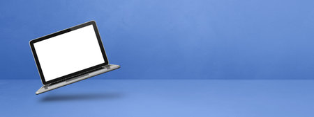 Blank computer laptop floating over a blue background. 3D isolated illustration. Horizontal banner templateの写真素材