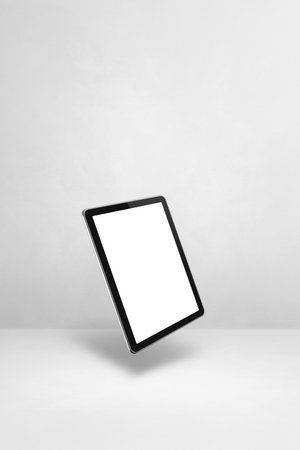 Blank tablet pc computer floating over a white background. 3D isolated illustration. Vertical templateの写真素材