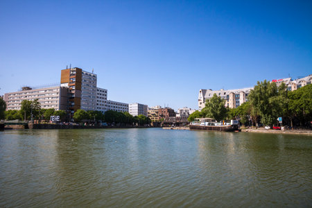 Paris - France - June 05, 2023 : Ourcq canal and houseboat view from the banks in summerのeditorial素材