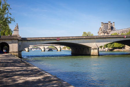 Louvre museum and Carrousel bridge view from the Seine river banks, Paris, Franceの写真素材