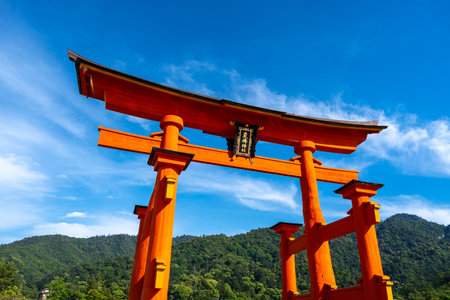 The famous floating torii gate of Itsukushima-jinja shrine stands in the sea near Miyajima Island, near Hiroshima, Japan. Close-up viewの写真素材