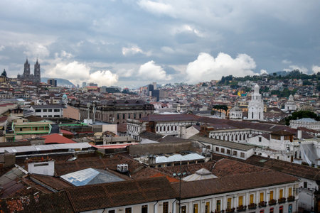 A panoramic view from the roof of the San Francisco church in Quito, Ecuador, showing the cityâs rooftops and distant mountainsの写真素材