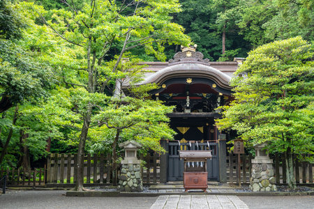 Hidden among lush greenery, Shirahata Shrine stands peacefully within the sacred grounds of Tsurugaoka Hachiman-gu in Kamakura, inviting quiet reflectionの写真素材