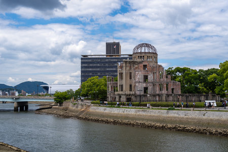 The Genbaku Dome in Hiroshima Peace Memorial Park and Motoyasu river in Japan. Symbol of memory and global call for peaceの写真素材