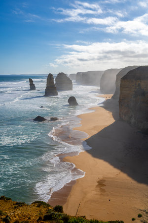 The majestic limestone stacks of the Twelve Apostles rise from the ocean along the Great Ocean Road, Victoria, Australia, creating a breathtaking coastal landscapeの写真素材