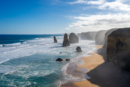 The majestic limestone stacks of the Twelve Apostles rise from the ocean along the Great Ocean Road, Victoria, Australia, creating a breathtaking coastal landscapeの写真素材