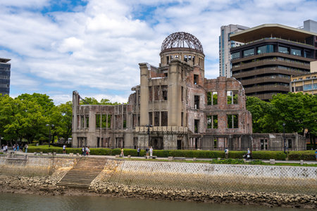The Genbaku Dome in Hiroshima Peace Memorial Park and Motoyasu river in Japan. Symbol of memory and global call for peaceの写真素材