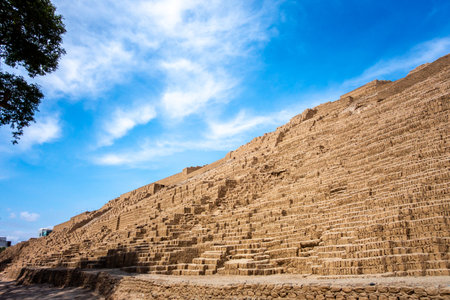 The Huaca Pucllana pyramid in Lima, Peru, is an ancient archaeological site known for its step-like structure and cultural significanceの写真素材