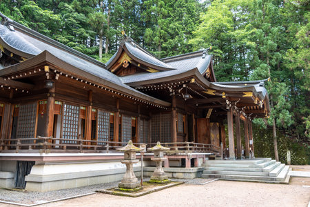 Traditional wooden structures of Sakurayama Hachimangu Shrine in Takayama, Japan, stand peacefully...