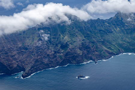 Hiva Oa, part of the Marquesas Islands in French Polynesia, features rugged green cliffs meeting the...