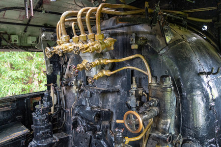 Steam locomotive C59161 stands on display in a peaceful Hiroshima park, offering a close look at its...