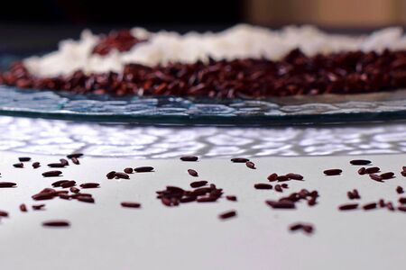 Cooked black and white rice close up, black graines on white backgroundの写真素材