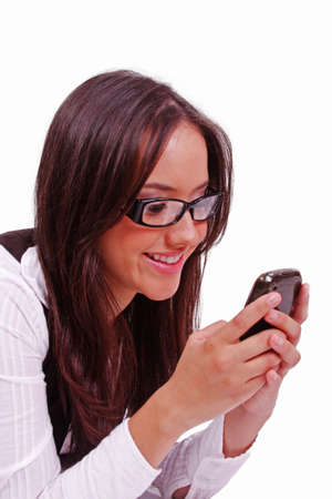 Beutiful happy woman sending text at mobile phoneの写真素材