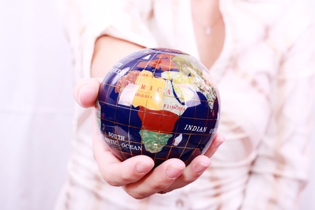 Beautiful Hand holding the world