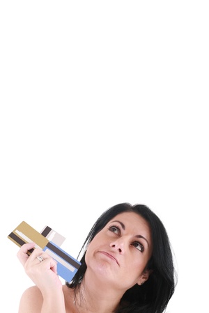 Upset Robed Woman Glaring At Her Many Credit Cards. の写真素材