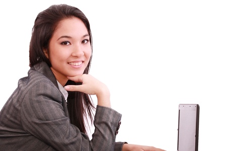 beautiful smiling business woman working on laptop の写真素材