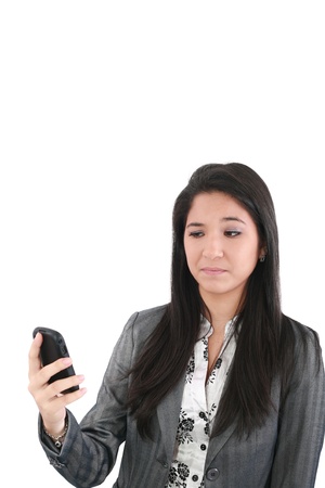 portrait of angry female looking at cellphone, isolated on white background の写真素材
