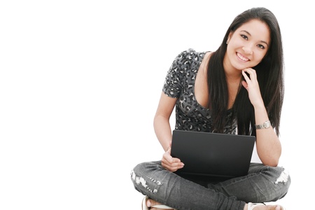 attractive young female sitting on the floor using laptop の写真素材