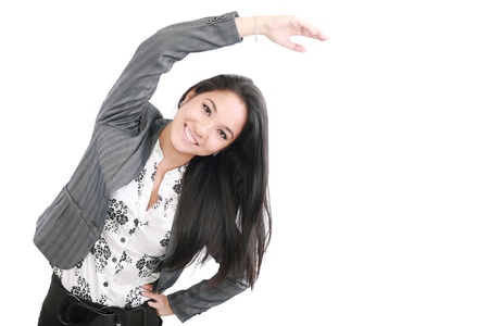 business woman portrait stretching isolated over a white background の写真素材